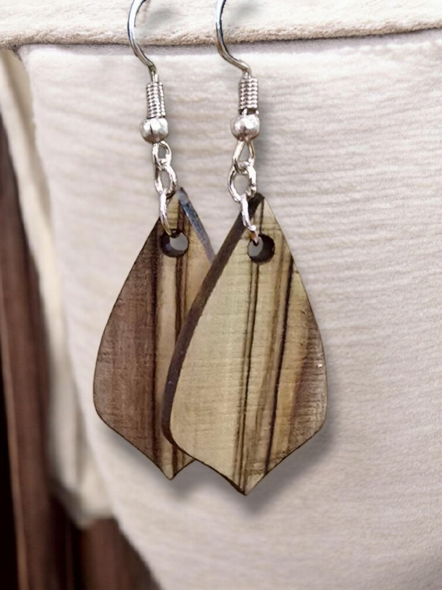 Handmade exotic wood earrings crafted by a veteran-owned small business, featuring a leaf-inspired design with natural striped grain.