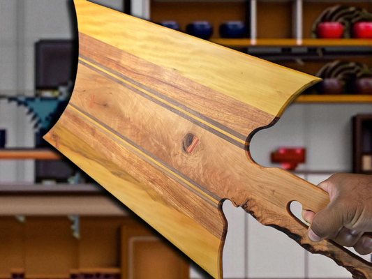Handmade charcuterie board with a live-edge handle.