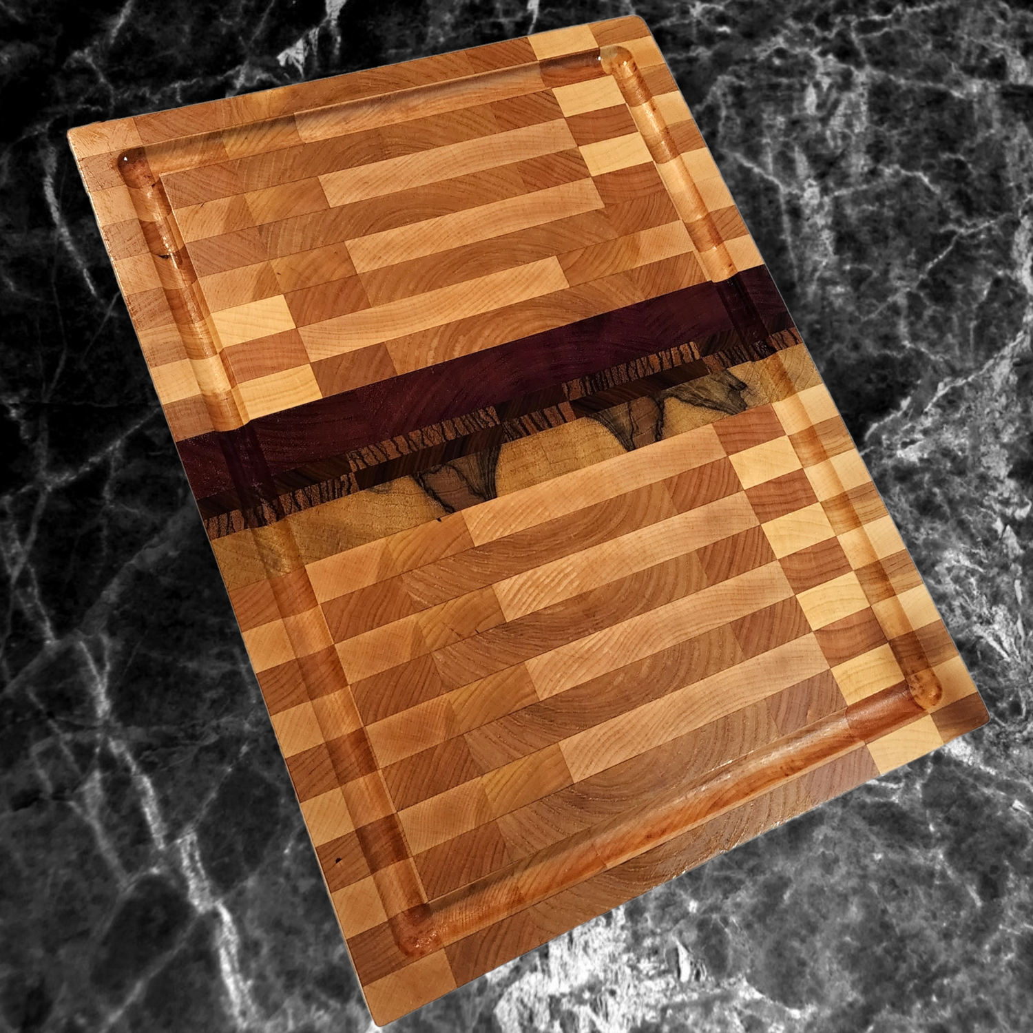 Wooden cutting board with a checkered pattern on a marble surface